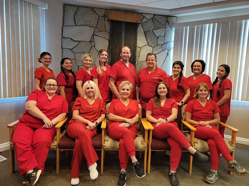 Mirci Dental Team all wearing red scrubs
