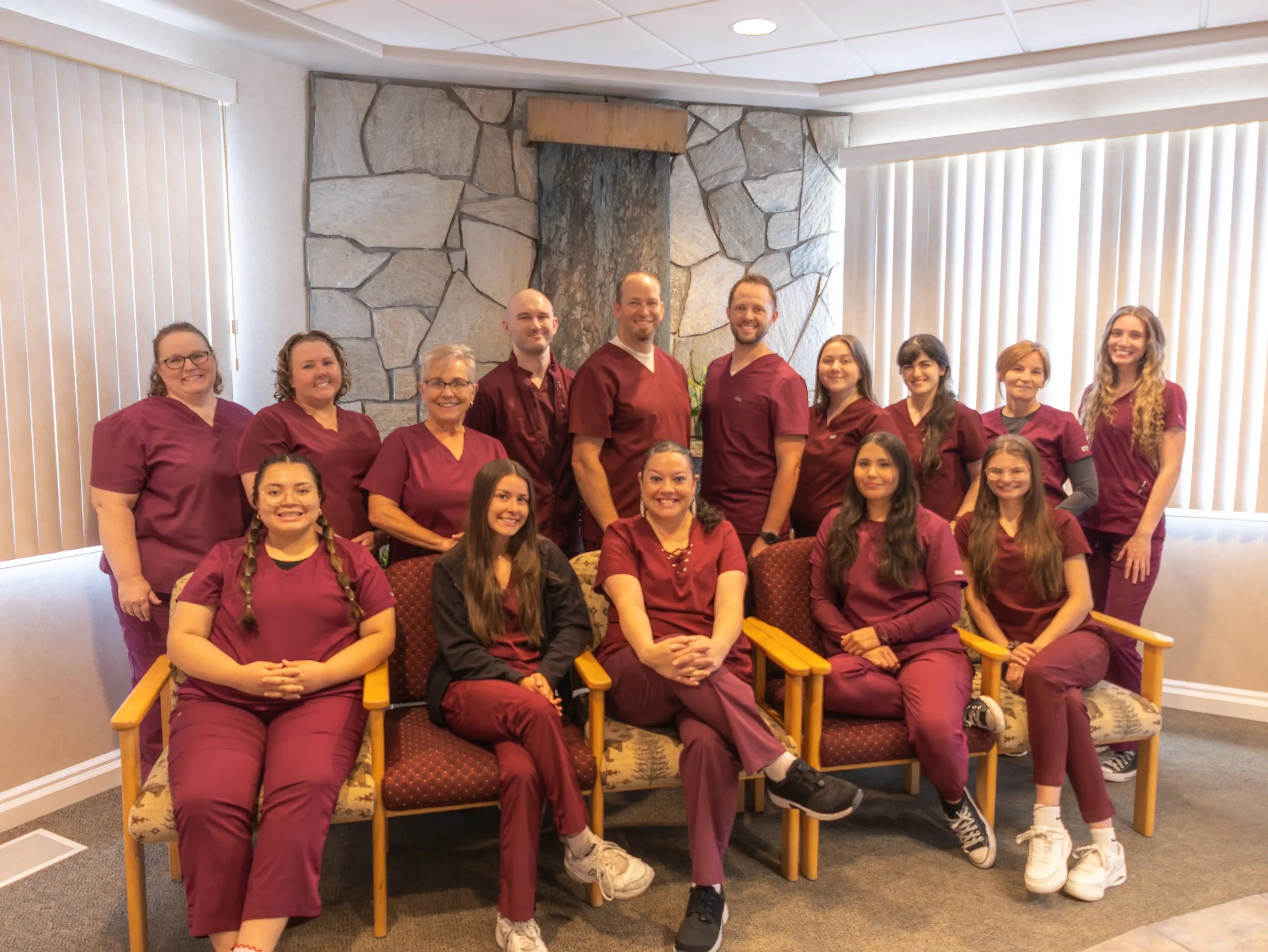 Mirci Dental Team all wearing red scrubs